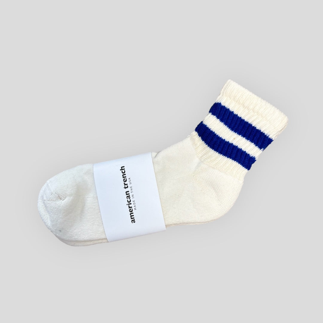 The Mono Stripe Quarter Crew for men is a white sock with royal blue stripes on the shaft. It hits just above the ankle so you get the look of the tube sock without it shortening the leg.