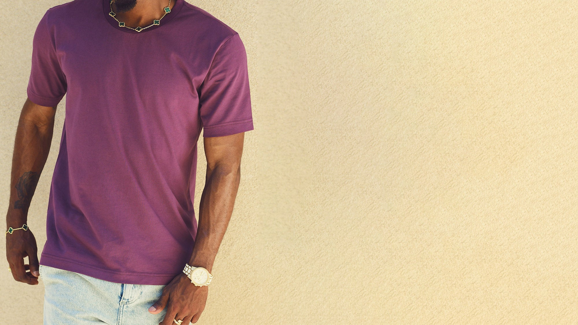 Model is wearing our light aubergine colored tee-shirt. It is a short sleeve, crew neck cotton tee in a purple color.