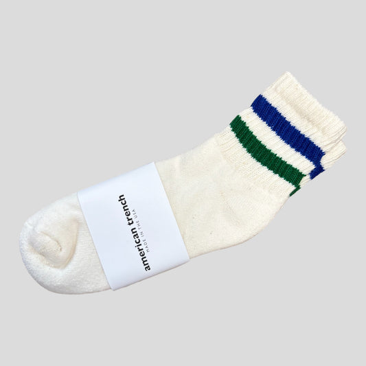 The Retro Stripe Quarter Crew Sock is a white sock that hits just past the ankle, there is a royal blue and kelly green stripe on the shaft of the sock. The footbed has extra padding for extreme comfort. This length sock is great for someone who likes tube socks but prefers a length that keeps the leg looking long not stocky.